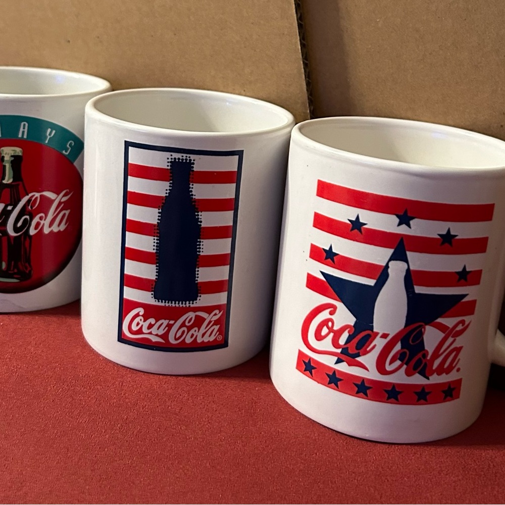 Coca-Cola 8oz cups.  All 3 for $12 total.  Images are on both sides of cup.